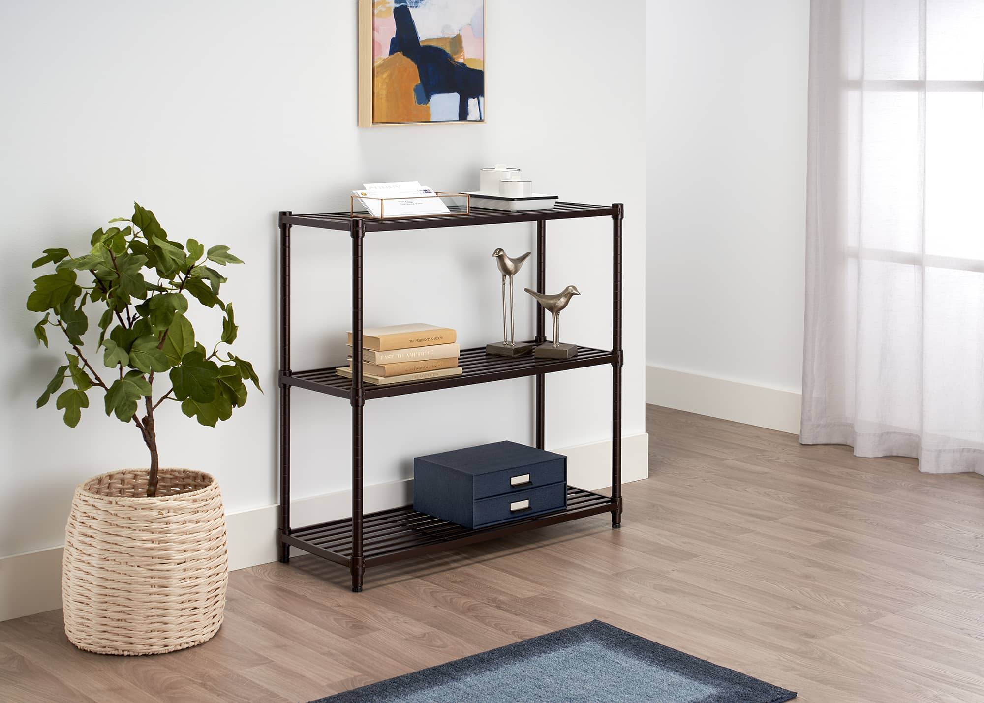 3 tier slat shelf used as console table in a living room