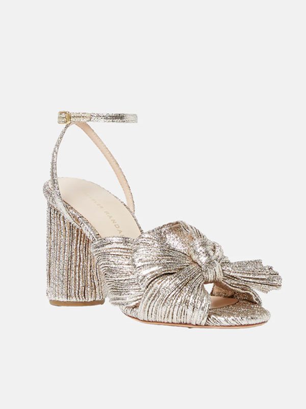 Silver high-heeled sandals with a knotted design and ankle strap.