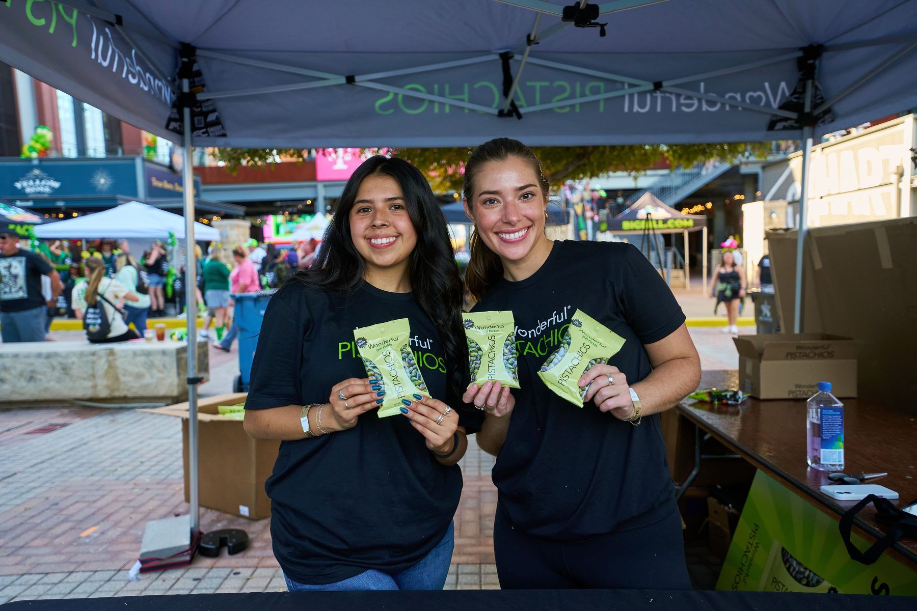 Wonderful Pistachios brand ambassadors handing out bags of Wonderful Dill Pickle Pistachios at The Big Dill Arlington Texas 2025.