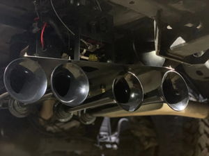 Four black train horn bells mounted beneath truck