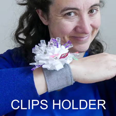Women wearing a wrist band that can hold sewing clips while sewing