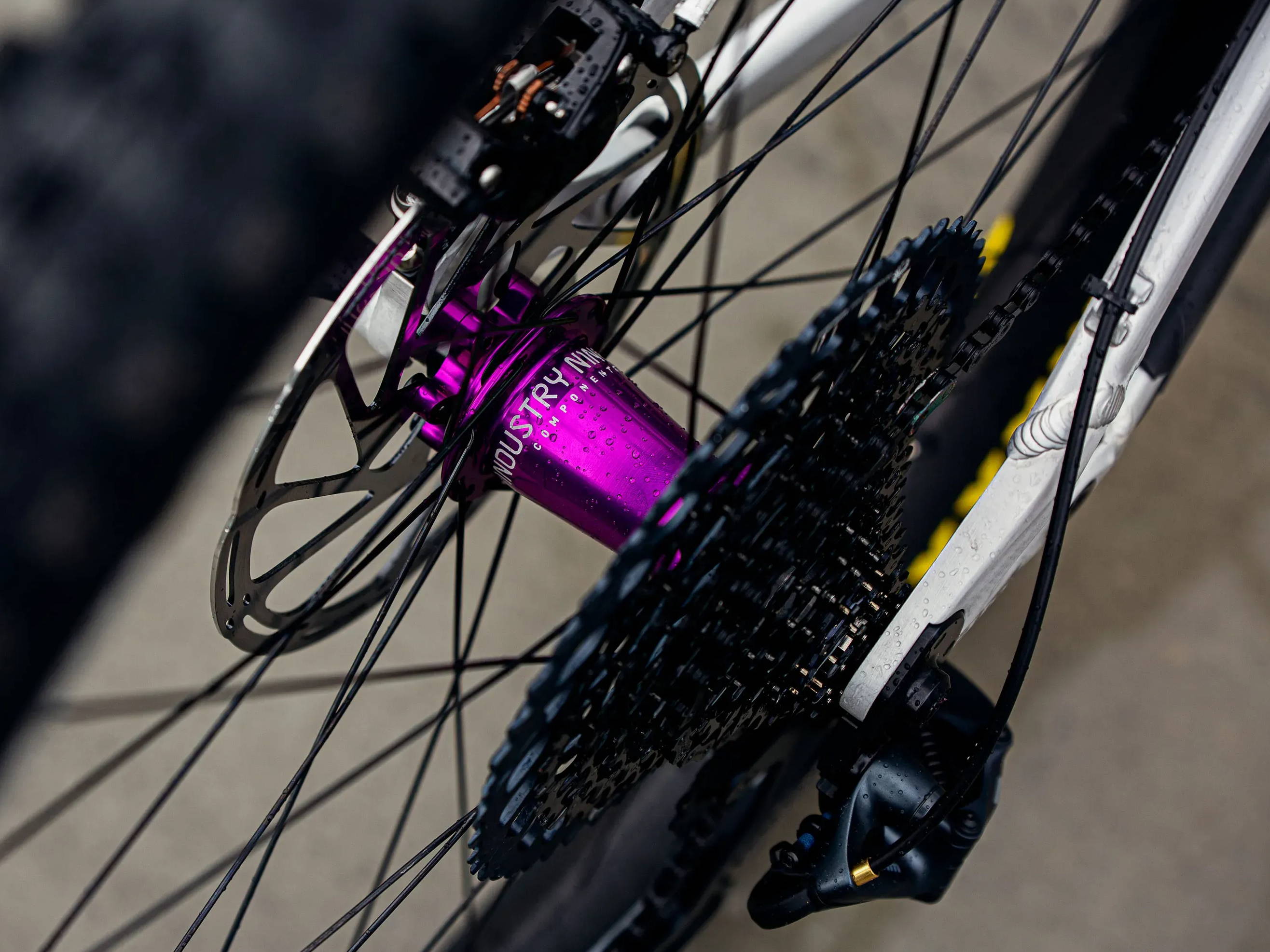 purple industry nine hydra hub laced to a mountain bike wheel from above