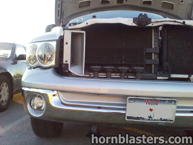 Front-side view of Robert's 2004 Dodge Ram train horn installation
