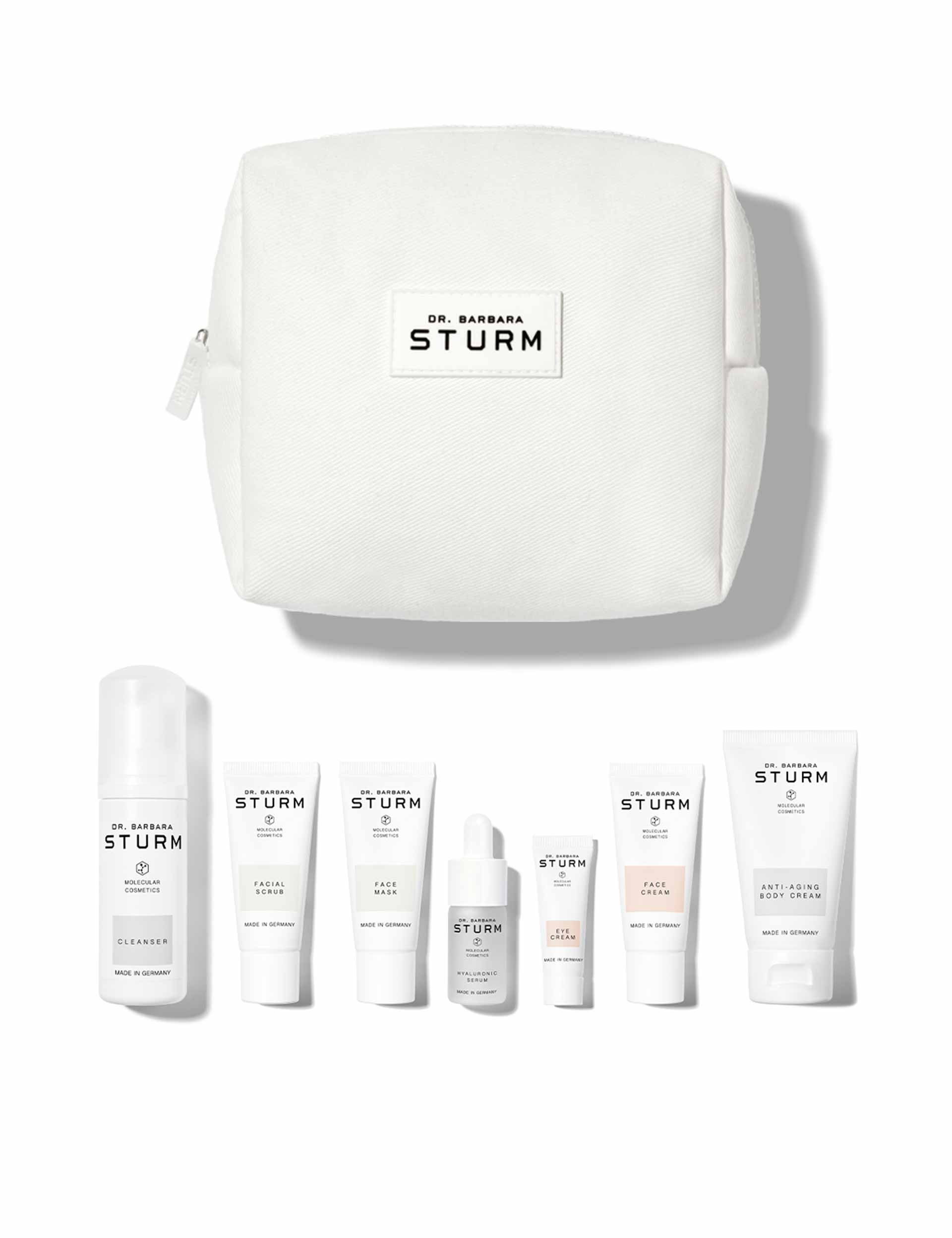 Beauty products displayed with a white travel pouch.