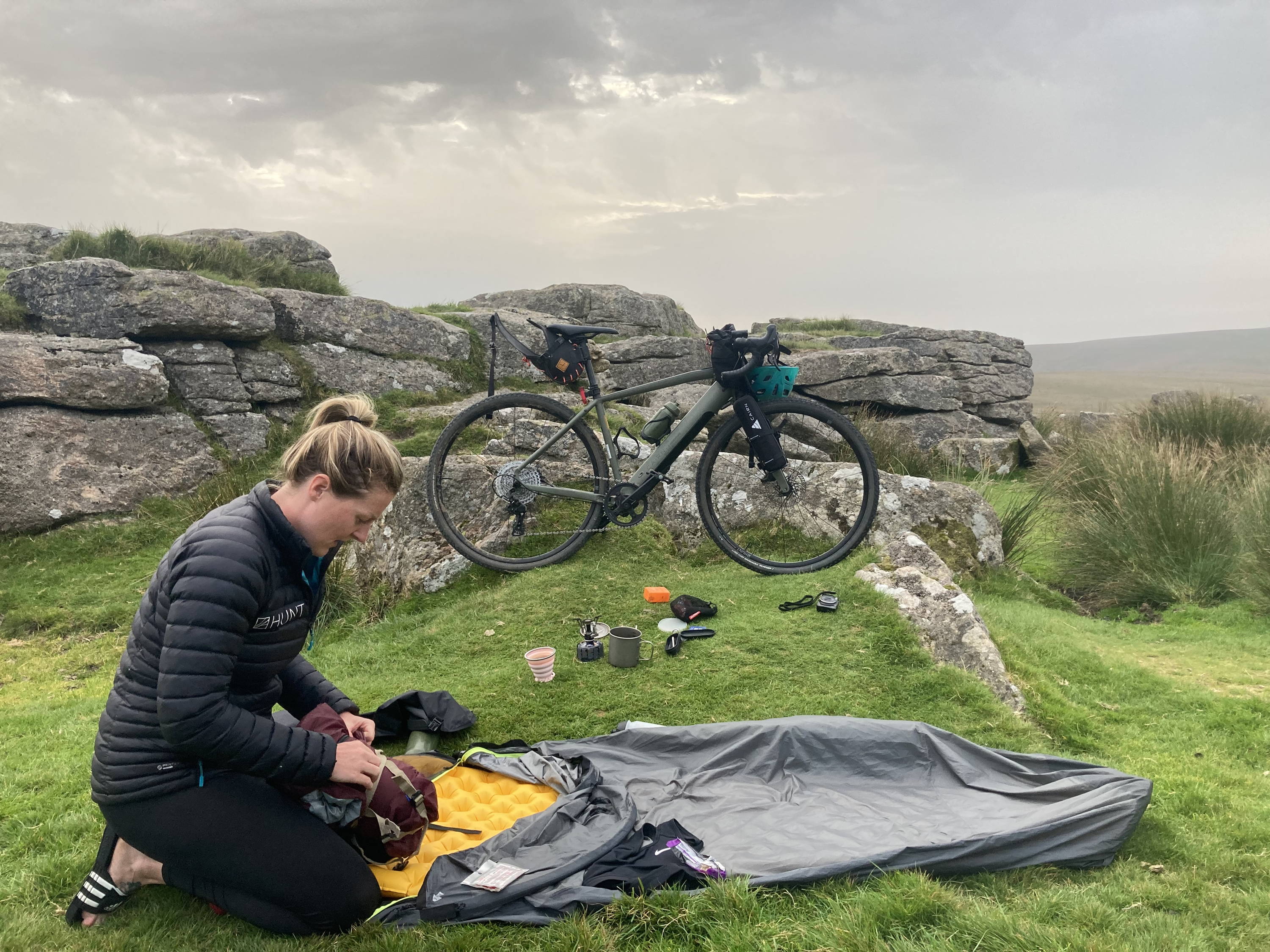 Gravel rider setting up a bivvy