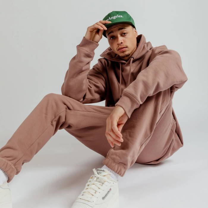 male model in maison article brown sweat suit
