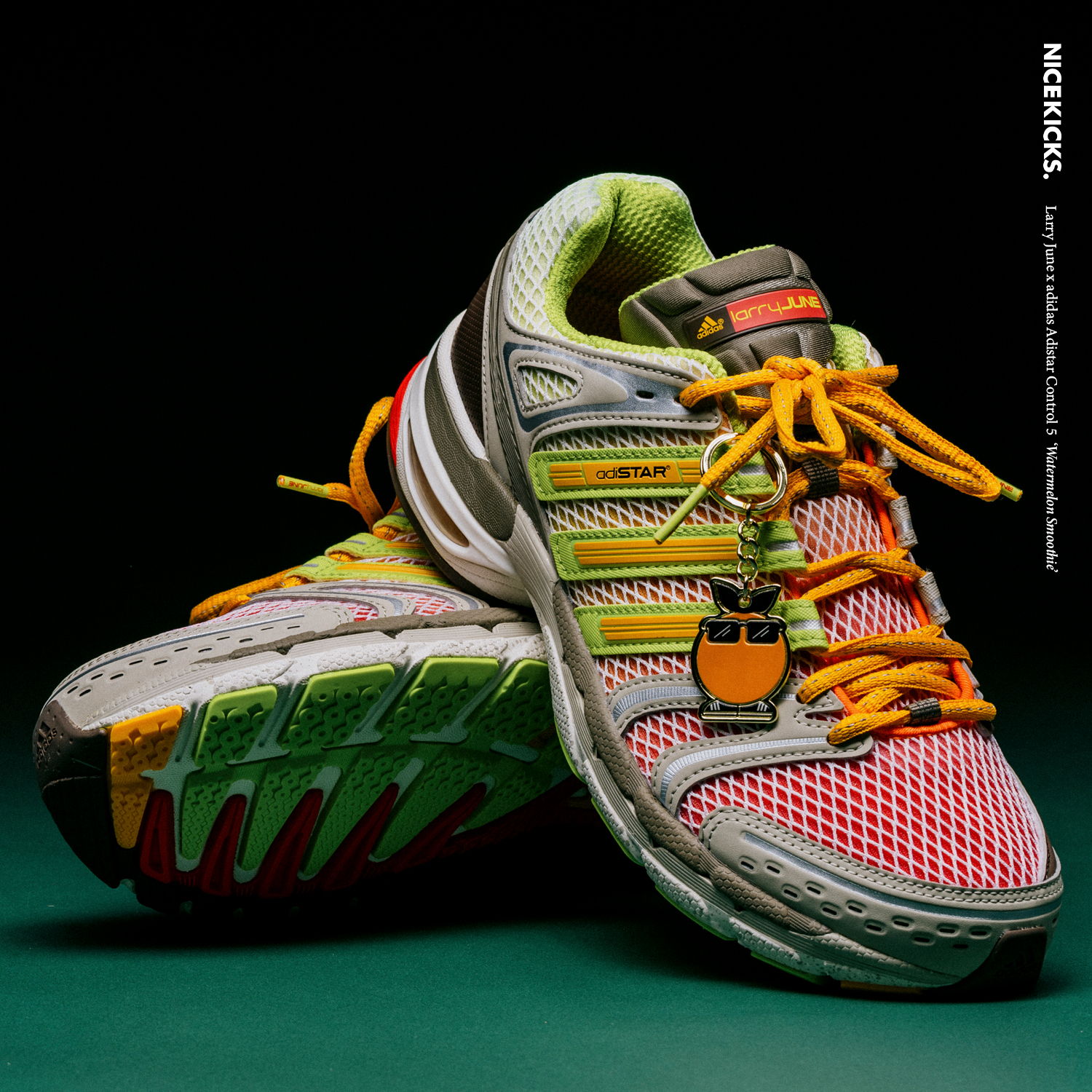 Colorful athletic shoes with vibrant laces on a dark background.