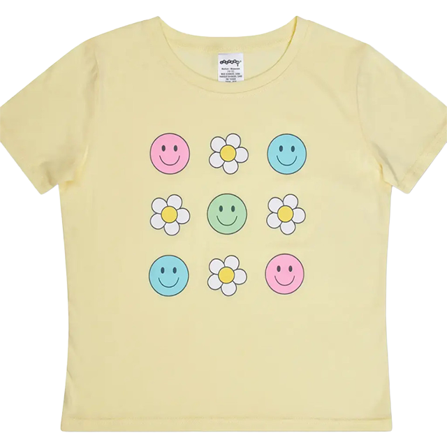 Yellow t-shirt featuring smiley faces and flowers in a grid pattern.