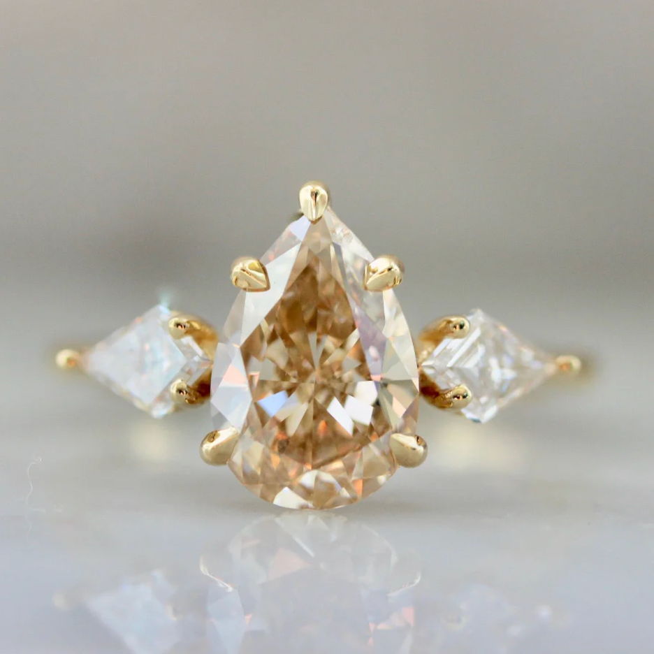 Pear shaped champagne diamond with white kite diamond side stones by Gem Breakfast