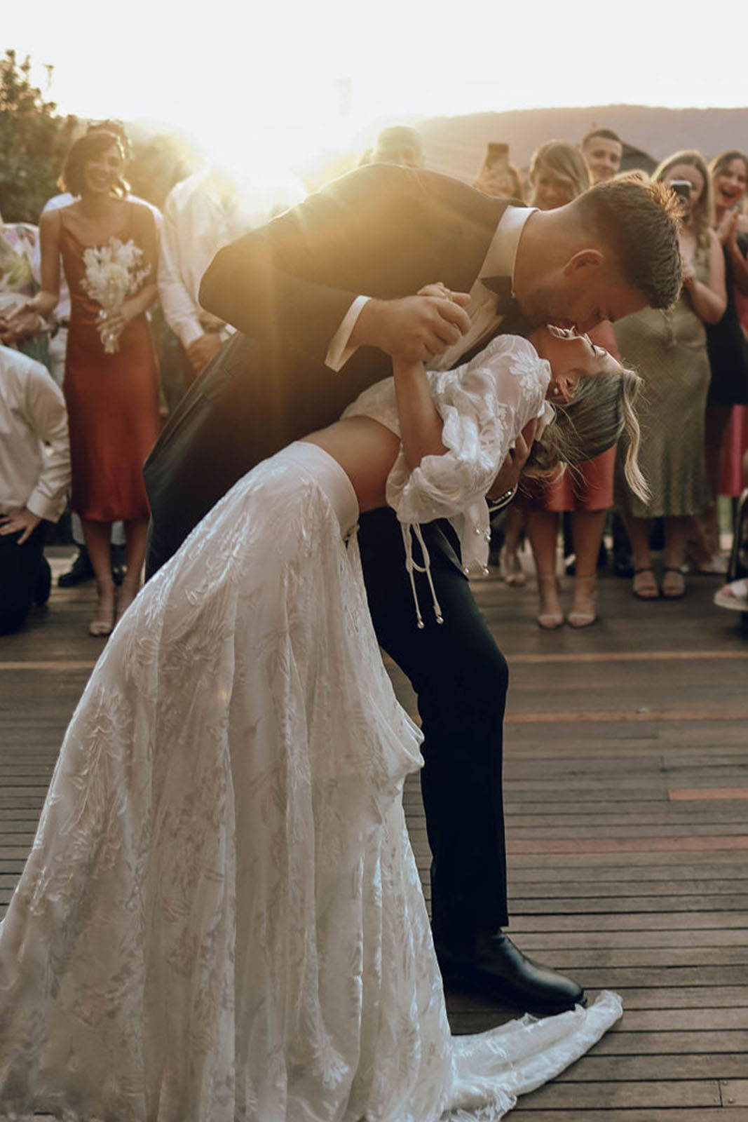 Bride and groom, sharing a romantic kiss