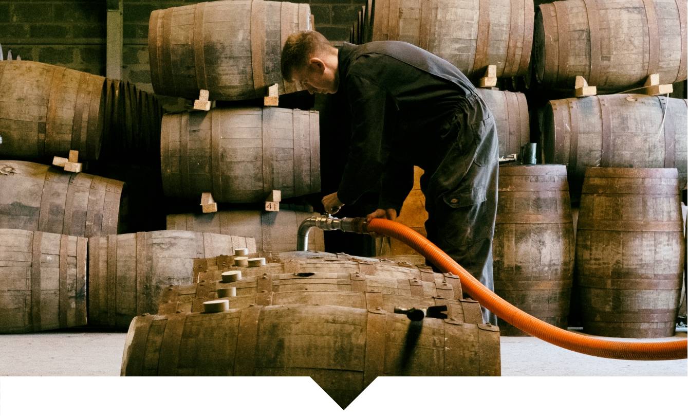 Filling casks with spirit in warehouse