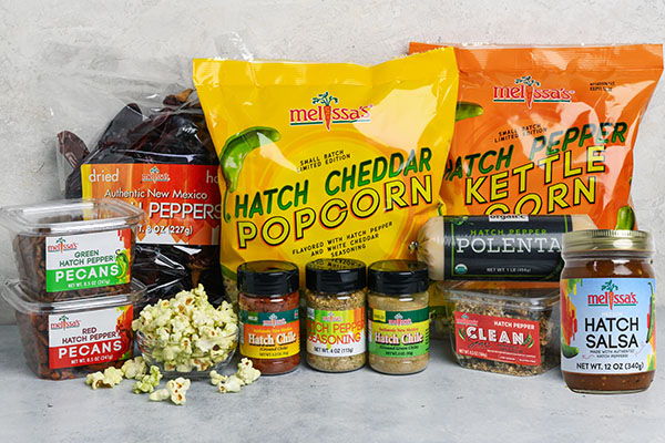 Assorted food products including popcorn, spices, and peppers.