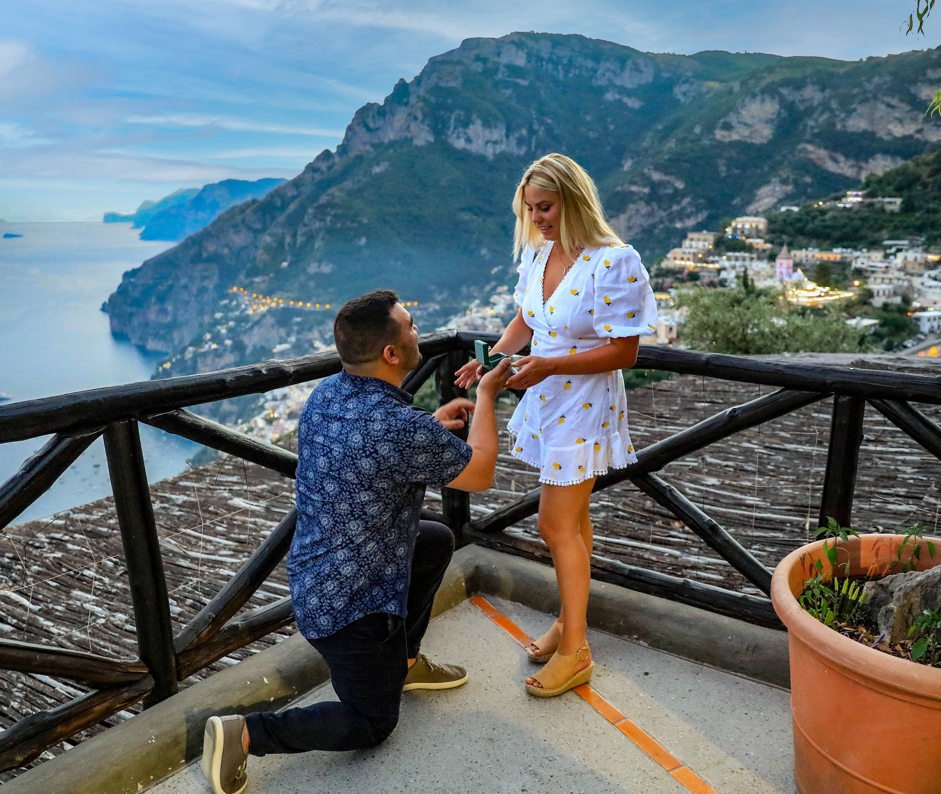 Anthony kneeling proposing to Abigail in Italy