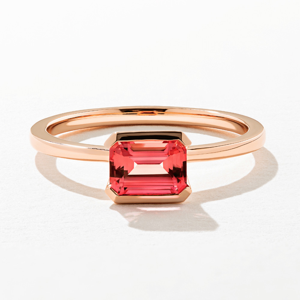 modern minimalist rose gold engagement ring with pink diamond center stone