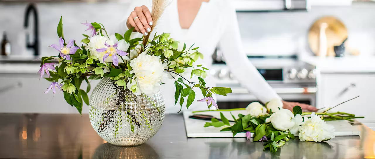 arranging spring flowers in vase
