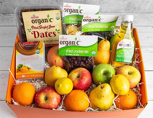 A fruit basket with various fruits and organic products.