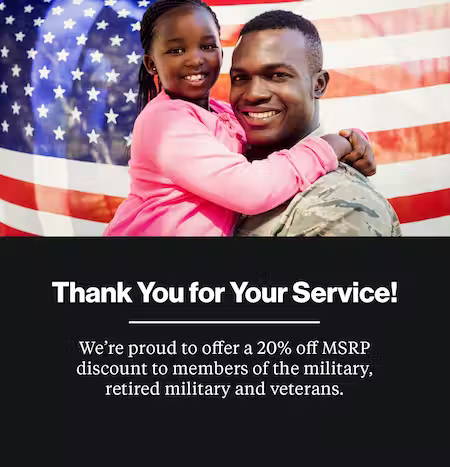 Military Dad holding his daughter. Thank you for your service. Military discount.