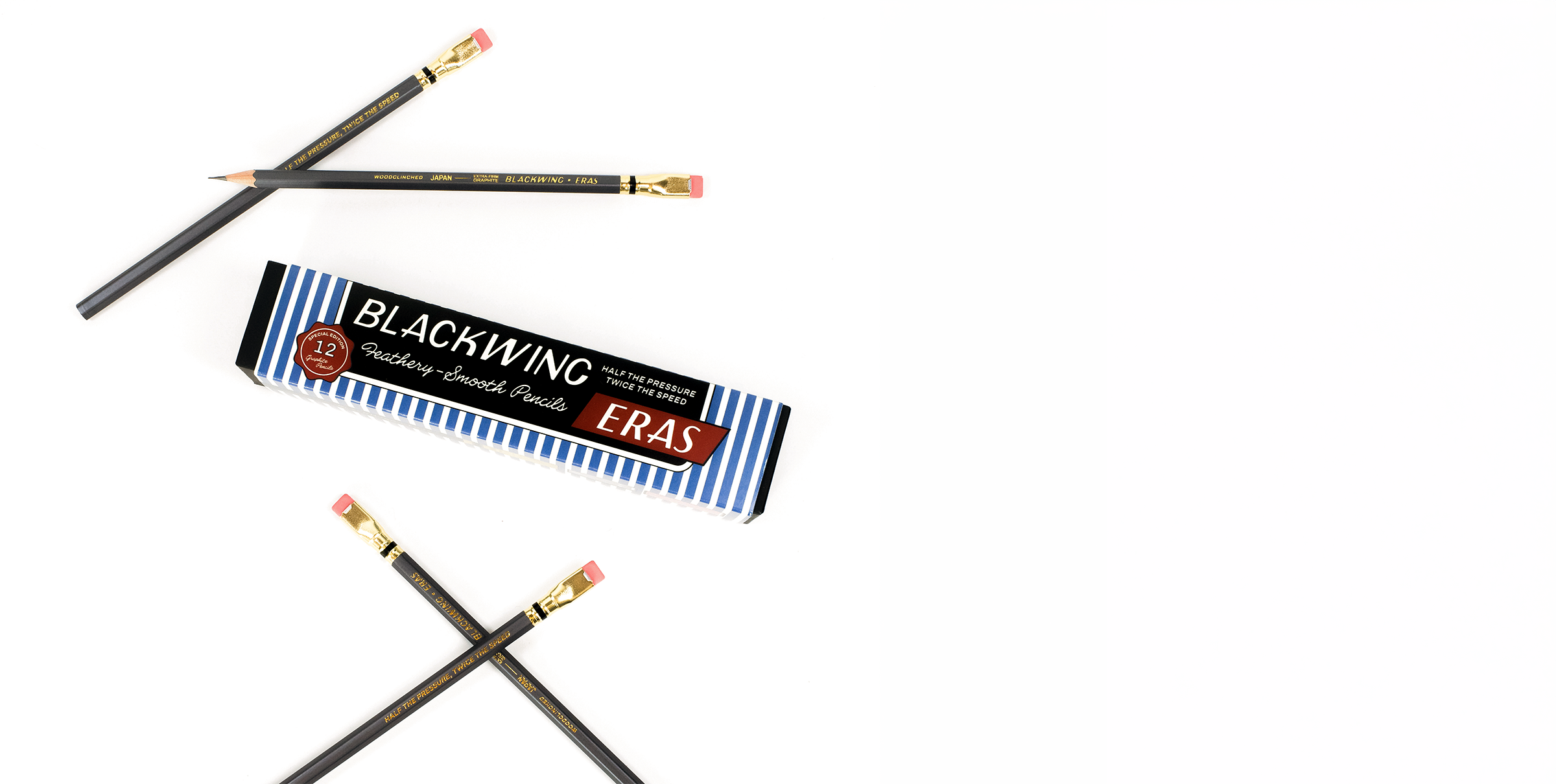 4 Blackwing Eras pencils featuring a dark grey barrel, dark gold ferrule, pink eraser, and gold imprint next to the blue and white striped packaging on a white background