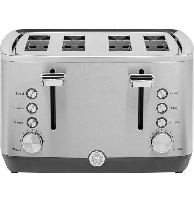A stainless steel toaster with four slots and control knobs.