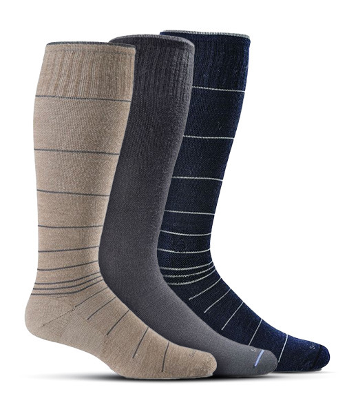 Tan, black and blue compression socks on white background.