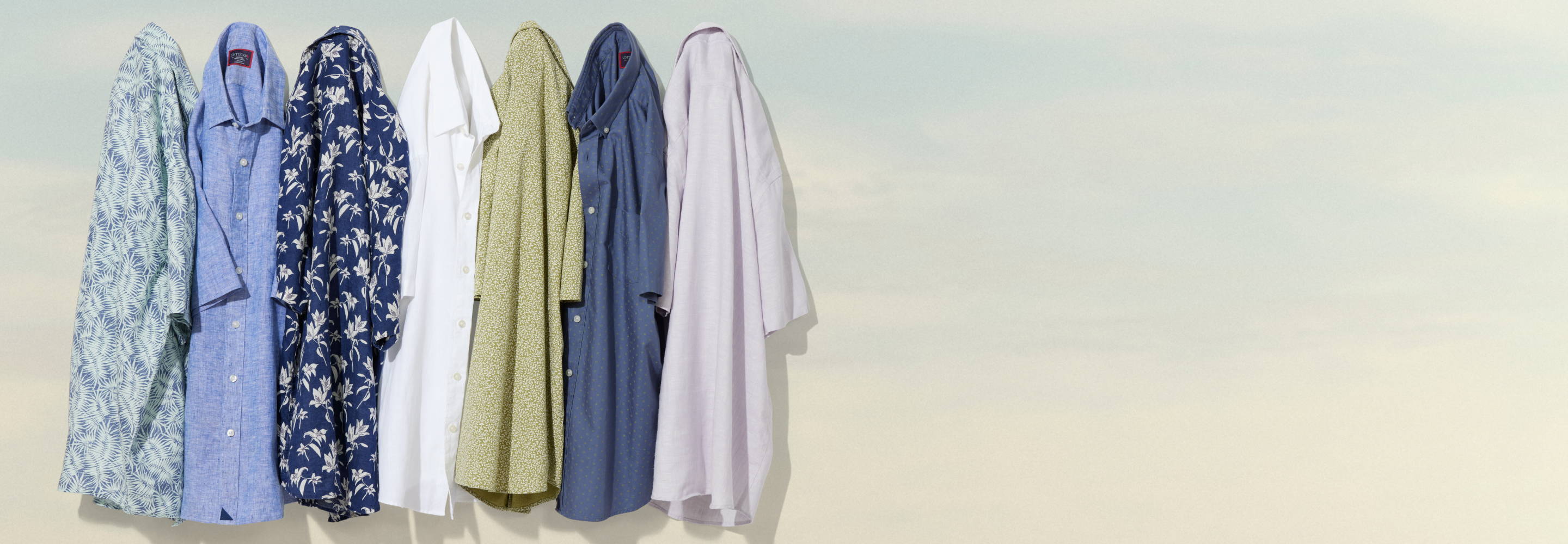 Collection of UNTUCKIt wrinkle-resistant linen shirts.