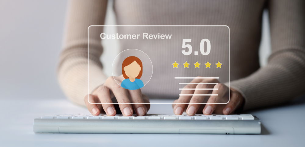 Person typing on a keyboard with a 5-star customer review graphic.