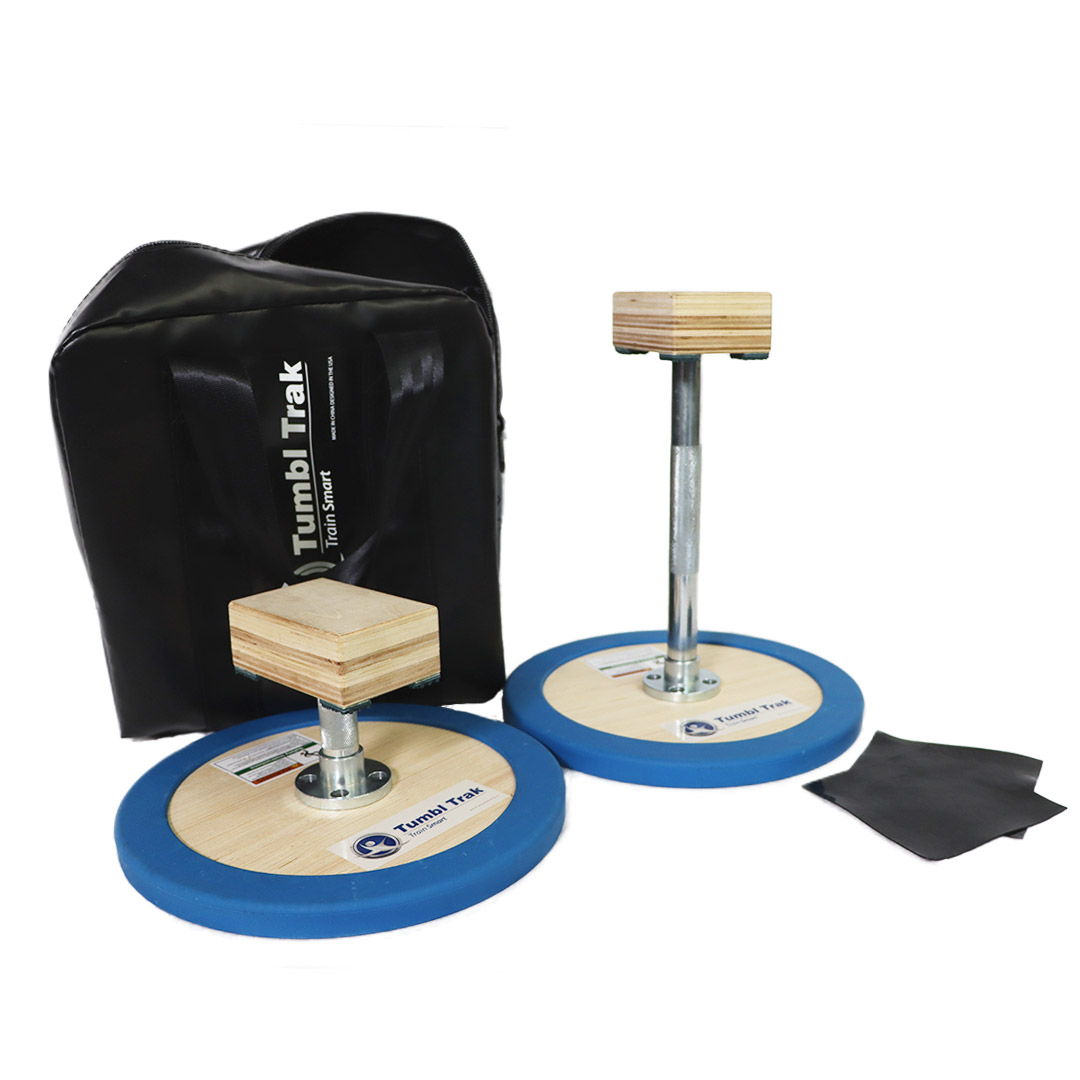 Gymnastics training equipment, including tumbling blocks and a carrying bag.
