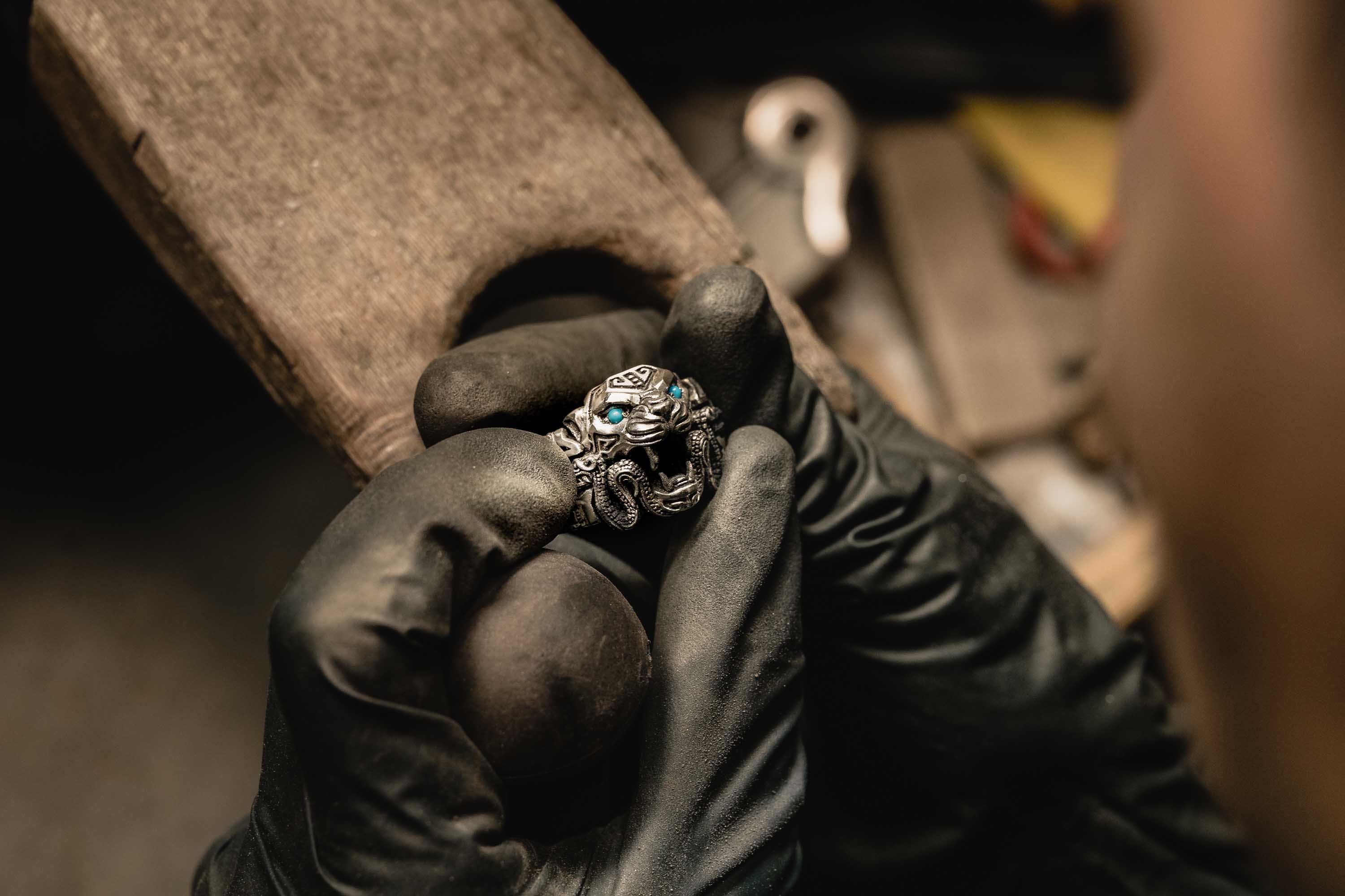 A completed Ocelotl Jaguar Ring in the hands of a NightRider Master Jeweler
