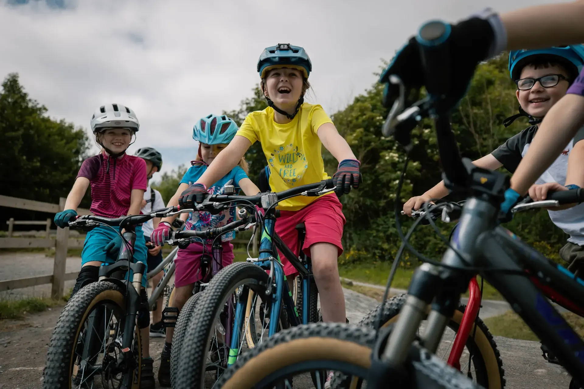 A group of kids riding Vitus bikes for young riders with 20