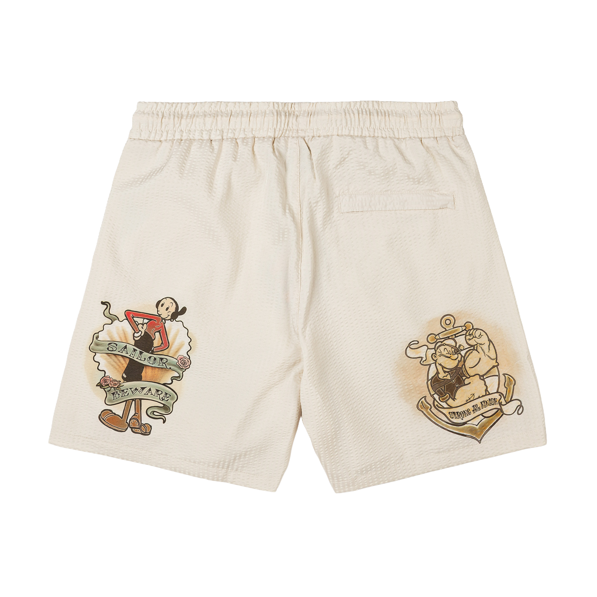 Beige shorts with decorative prints on each side.