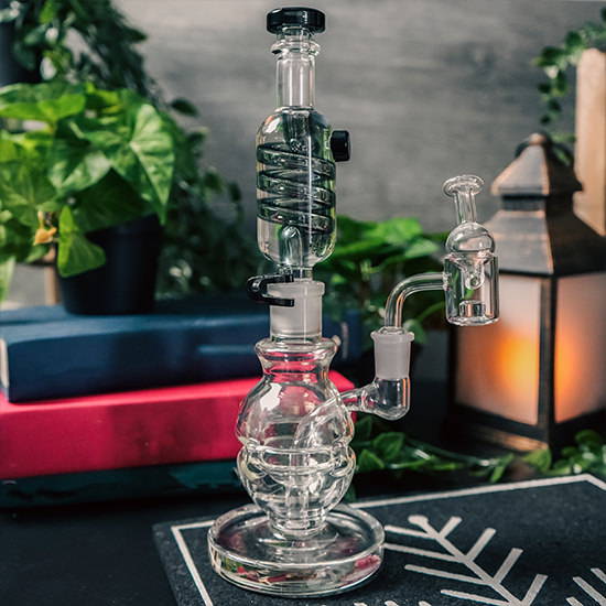 A glass dab rig on a mat