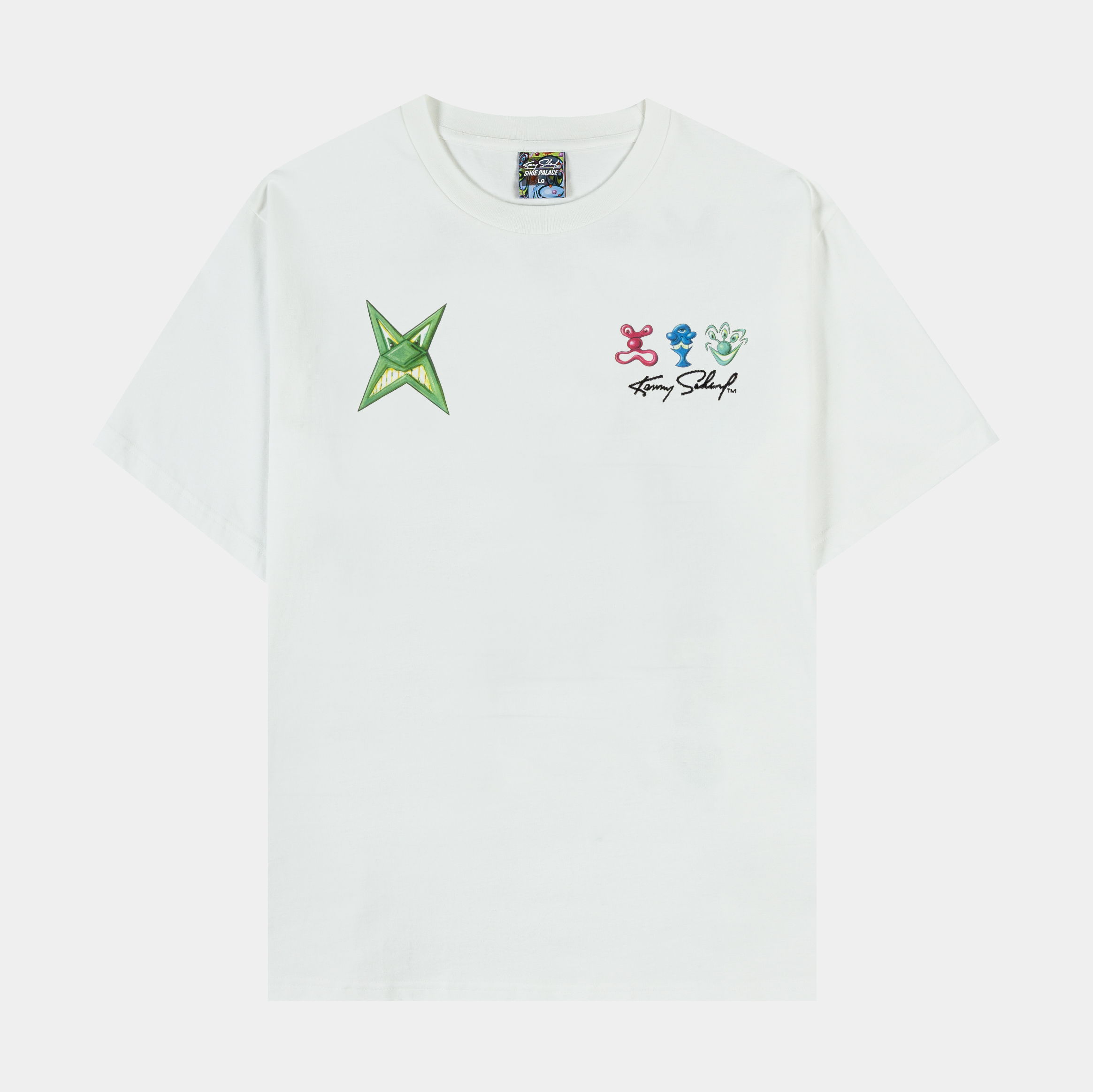 White t-shirt with colorful graphic designs and green star on the front.