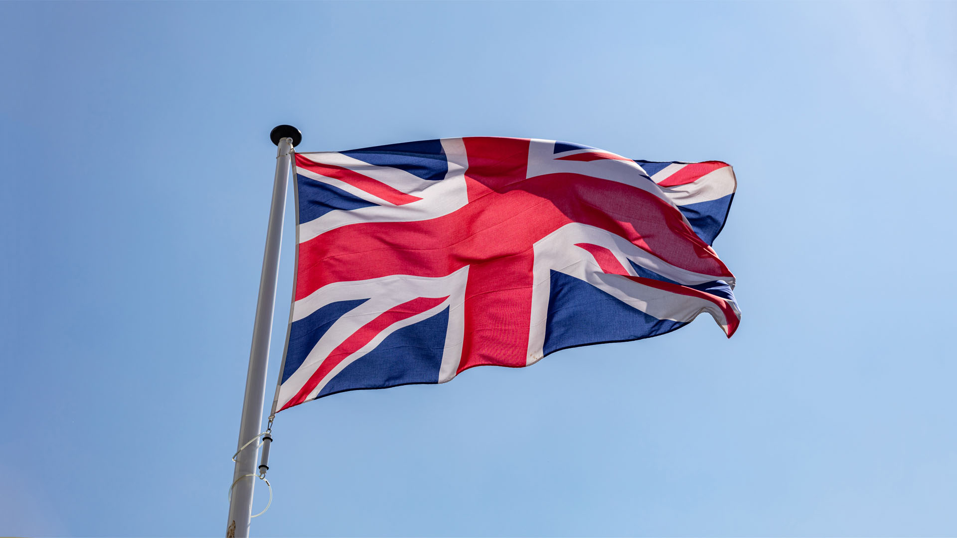 A picture of a Union jack flag blowing in wind