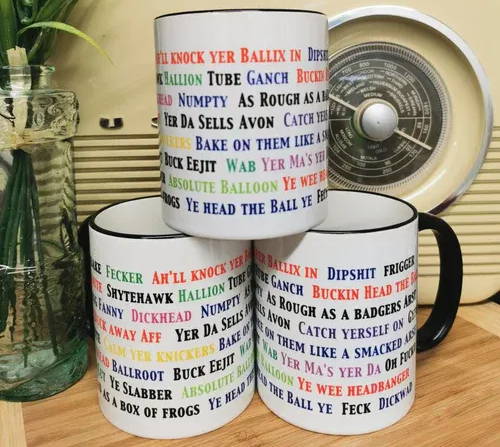 A stack of mugs with Northern Irish phrases