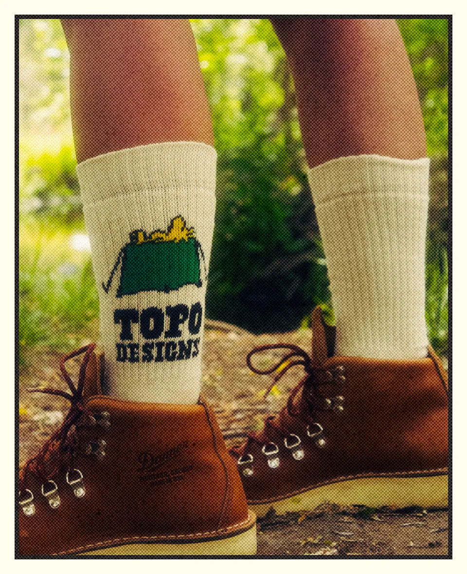 Person wearing brown boots and white socks with 