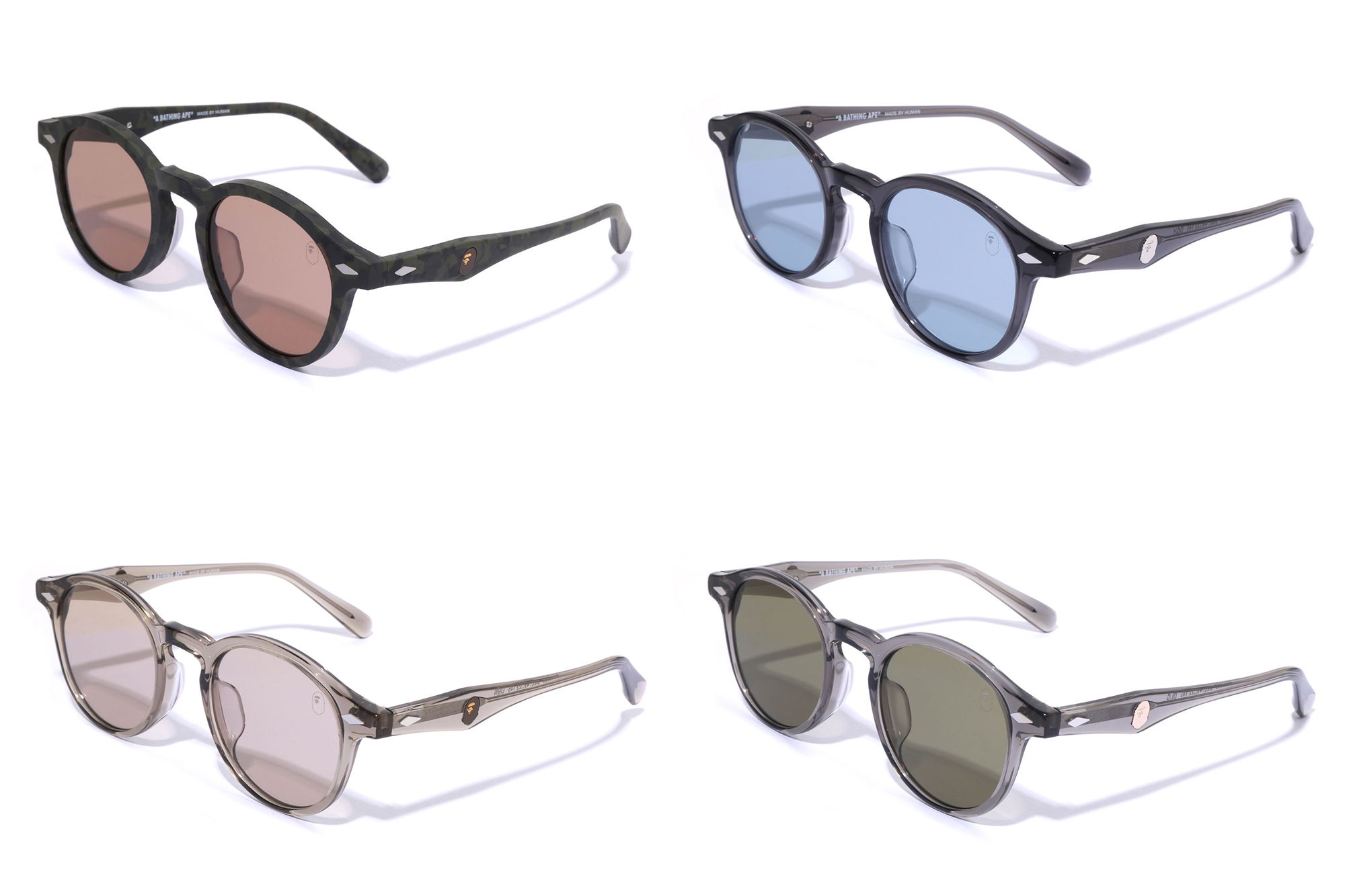 Four pairs of stylish sunglasses in different colors and shapes.
