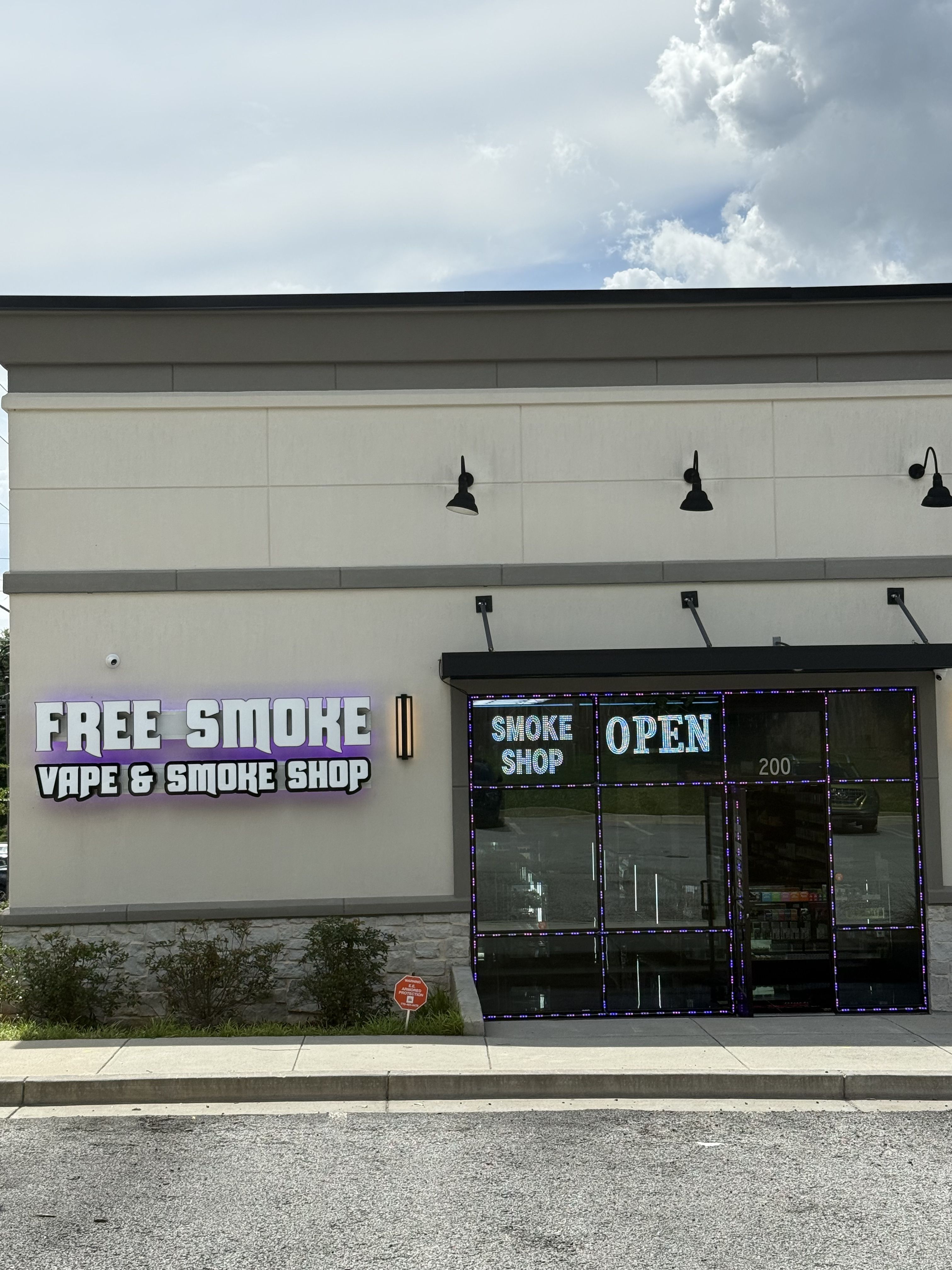 Storefront of a vape and smoke shop with 