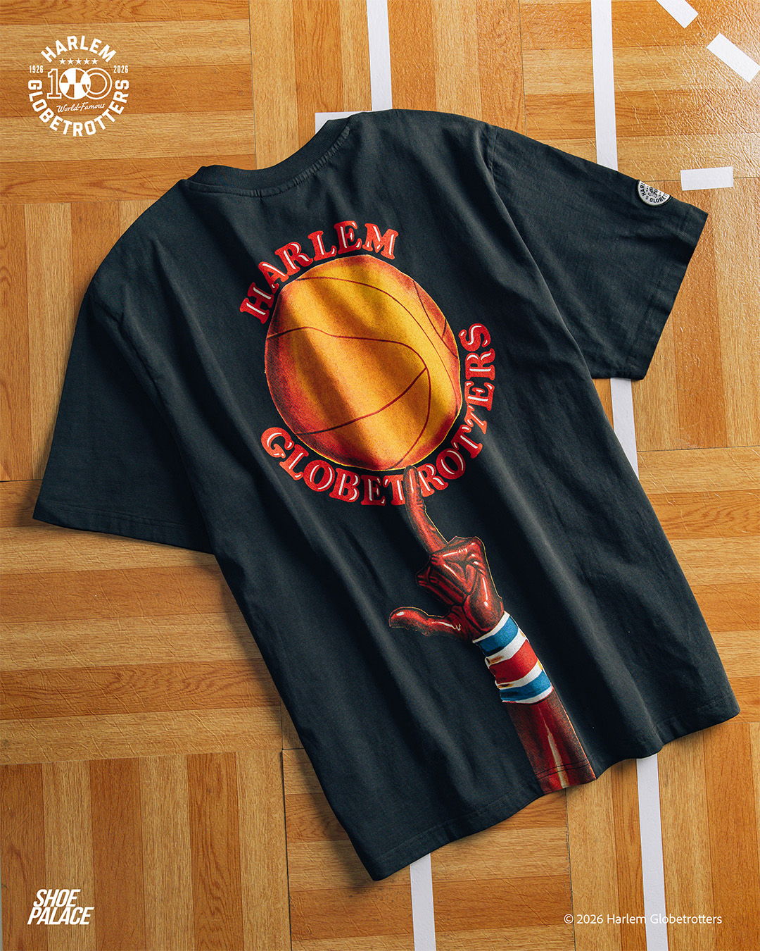 Black t-shirt featuring Harlem Globetrotters graphic and basketball design.