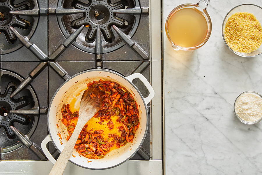 Tomato paste stirred into vegetable mixture