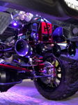 HornBlasters train horn kit with four black trumpets and red bracket illuminated by purple underglow lights