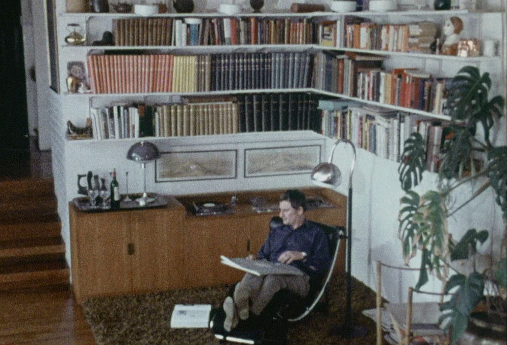 1971, Still of Robert Welch drawing in library at White House