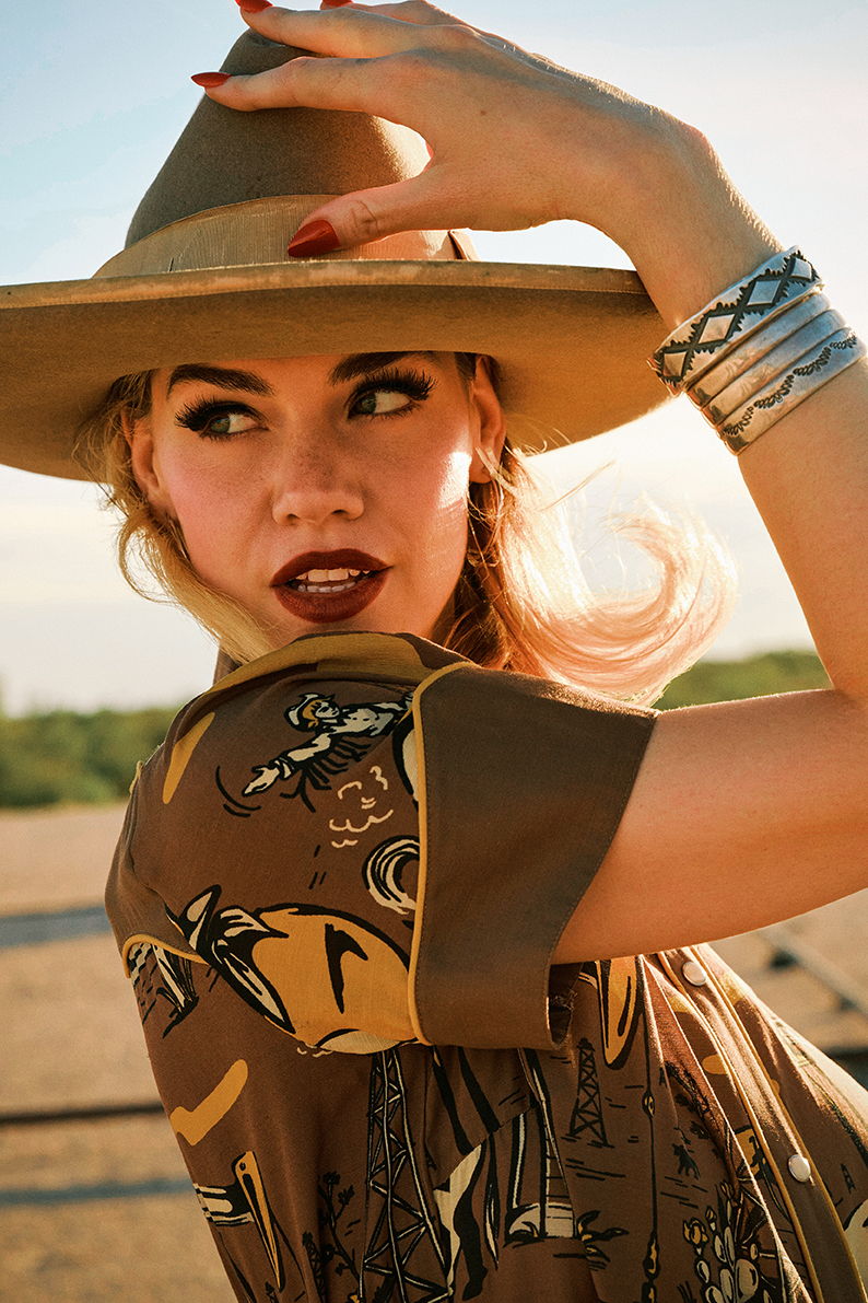 Lozzie wearing the Oil Camp Dress with Double D Ranch jewelry and accessories.