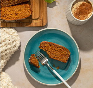 Slice of Pumpkin Bread on a plate. View this post on Tastefully Simple's Instagram.