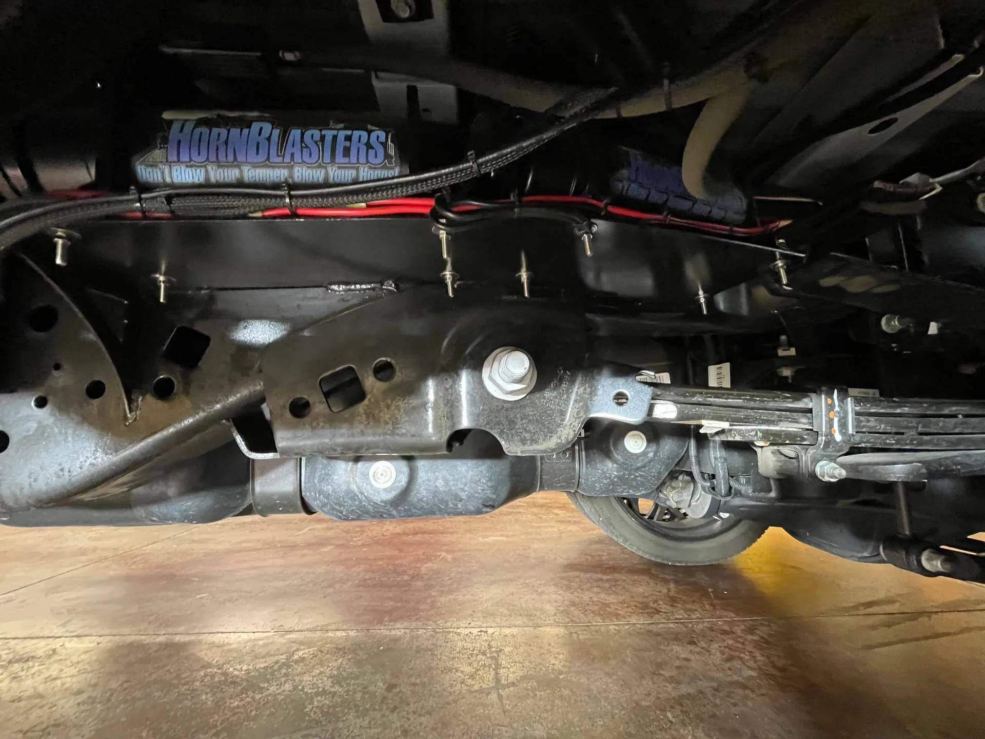 Undercarriage HornBlasters branded component mounted on Robert's Ford F450 truck frame photo 5
