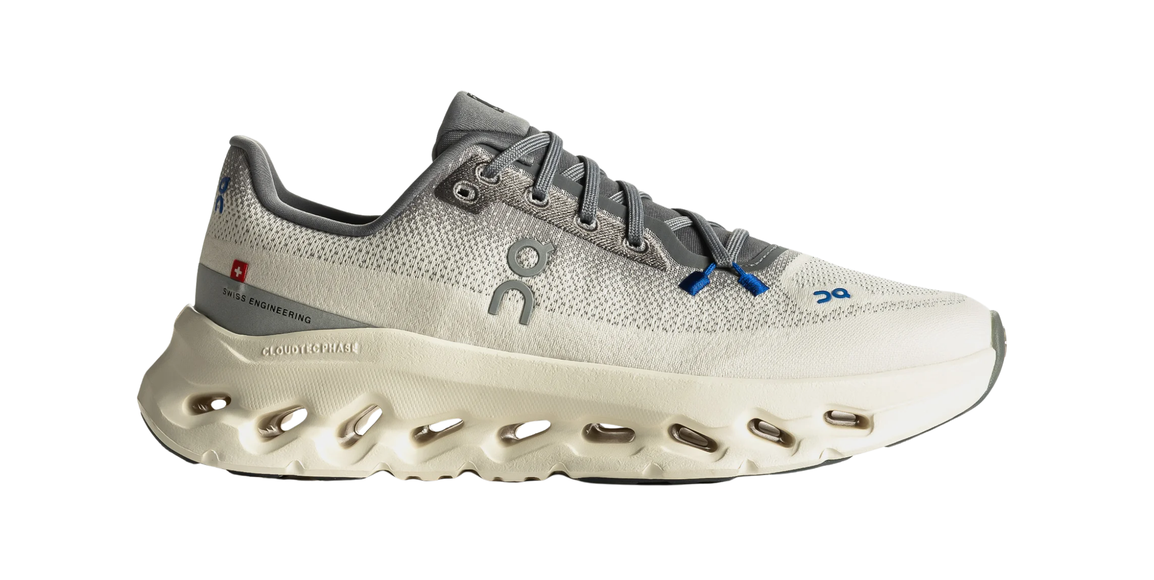 Gray athletic shoe with a unique sole design and blue accents.