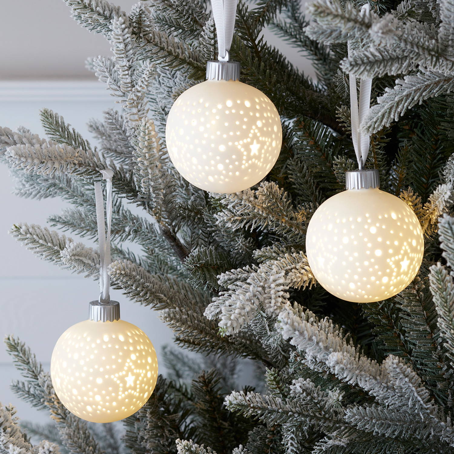 3 white LED baubles on a flocked Christmas tree.