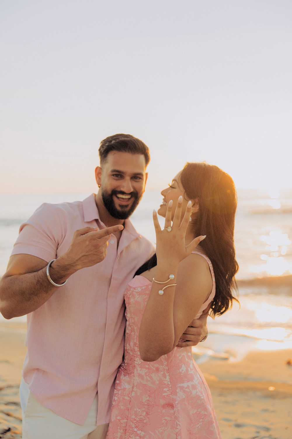 engaged couple at la jolla beach, showing off ring