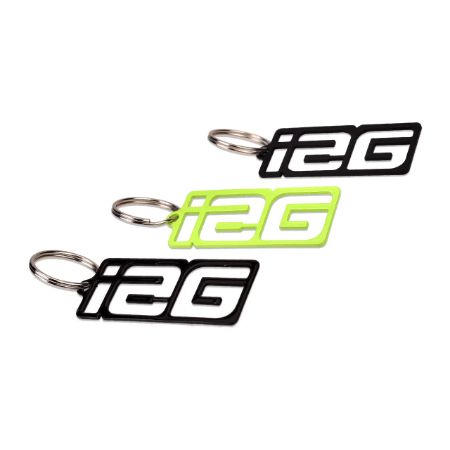 IAG laser cut key tags in black and green.