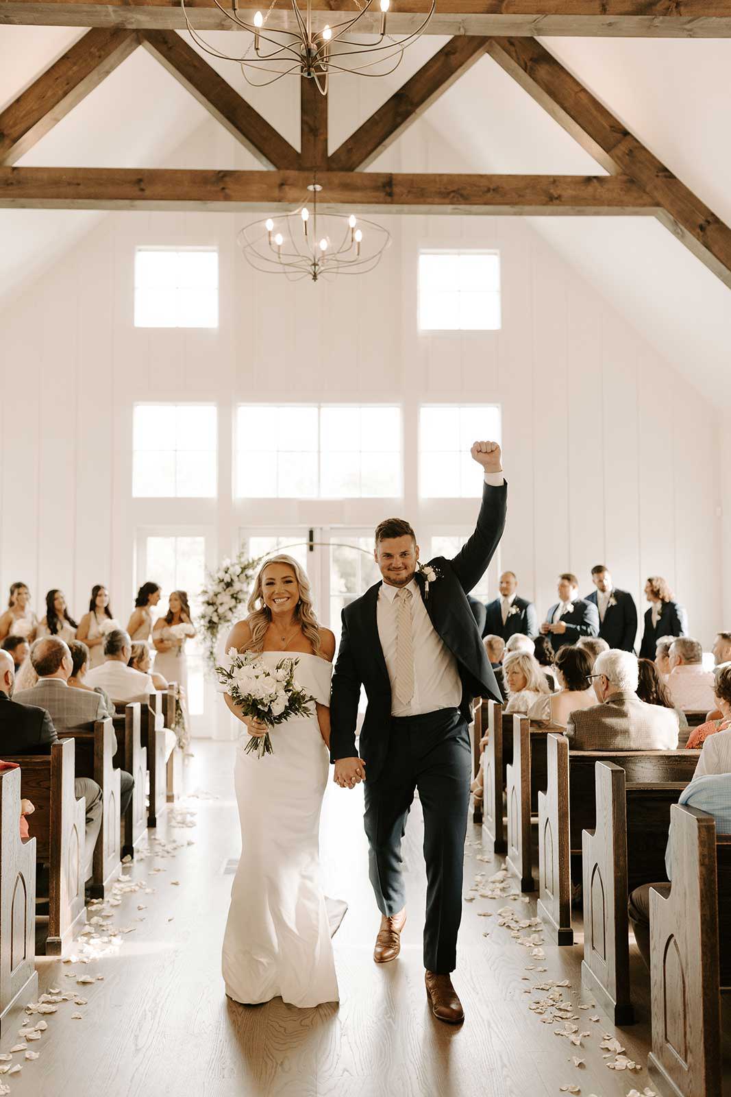 Bride and groom walking down aisle