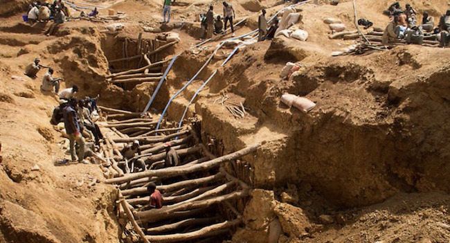 open pit mine in Africa showing harsh working conditions